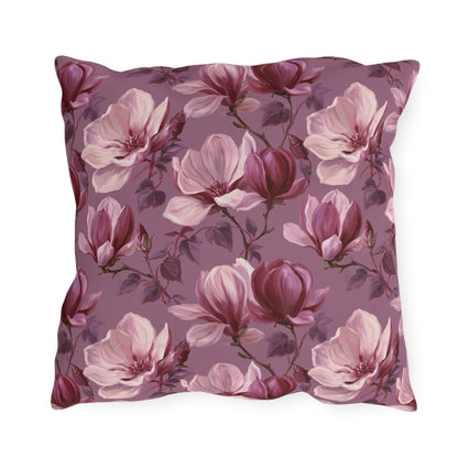 Blush and burgundy painted magnolias on mauve outdoor pillow