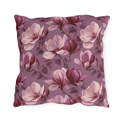 Blush and burgundy painted magnolias on mauve outdoor pillow