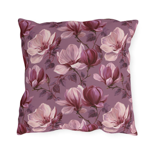 Blush and burgundy painted magnolias on mauve outdoor pillow