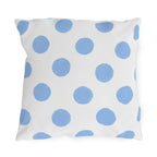Light blue polka dot outdoor pillow with hand-painted powder blue dots on bright white