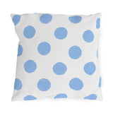 Light blue polka dot outdoor pillow with hand-painted powder blue dots on bright white