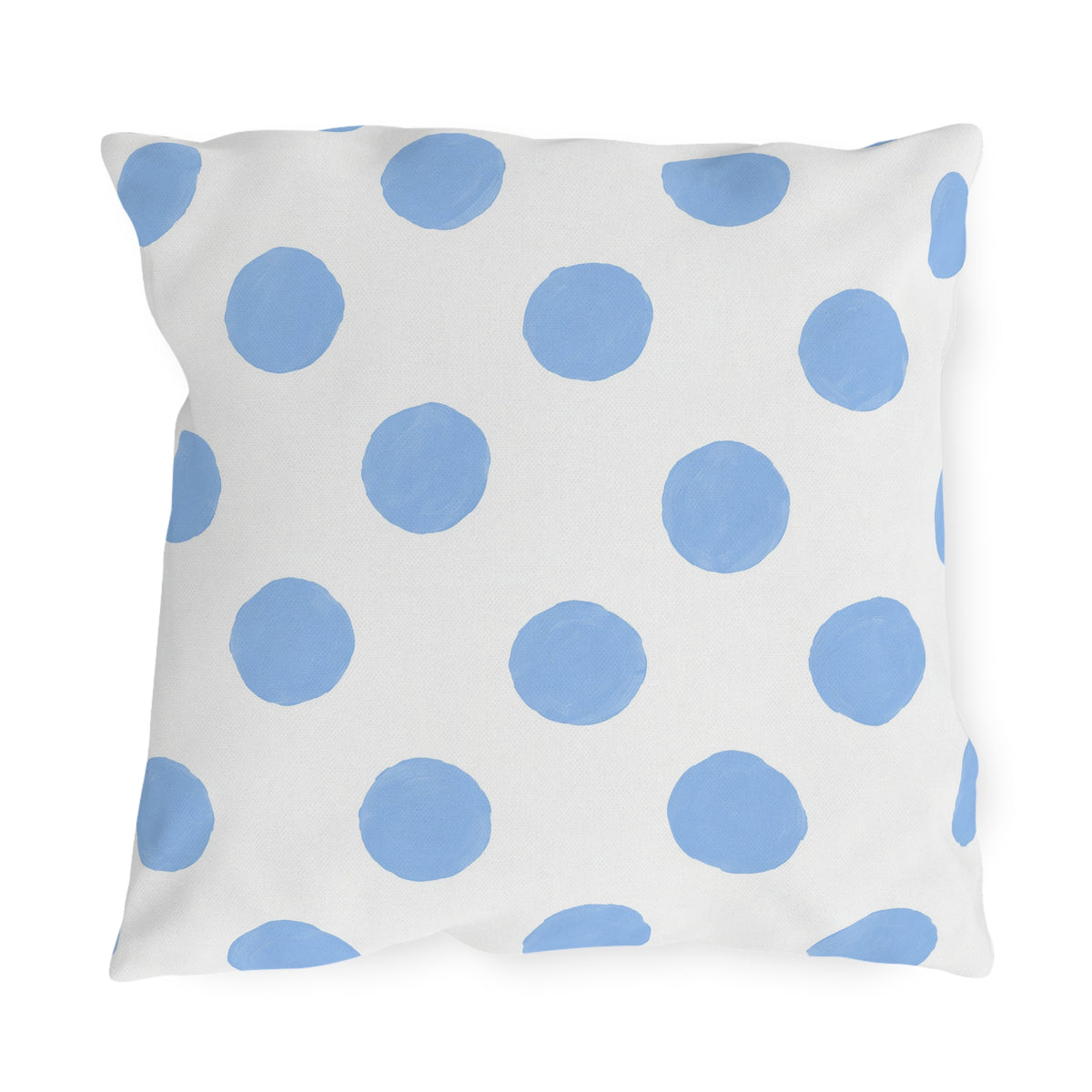 Light blue polka dot outdoor pillow with hand-painted powder blue dots on bright white