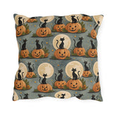 Black cats sitting on carved pumpkins under full moons on sage grey outdoor pillow