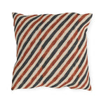 Diagonal rust and charcoal block-printed stripes on cream outdoor pillow
