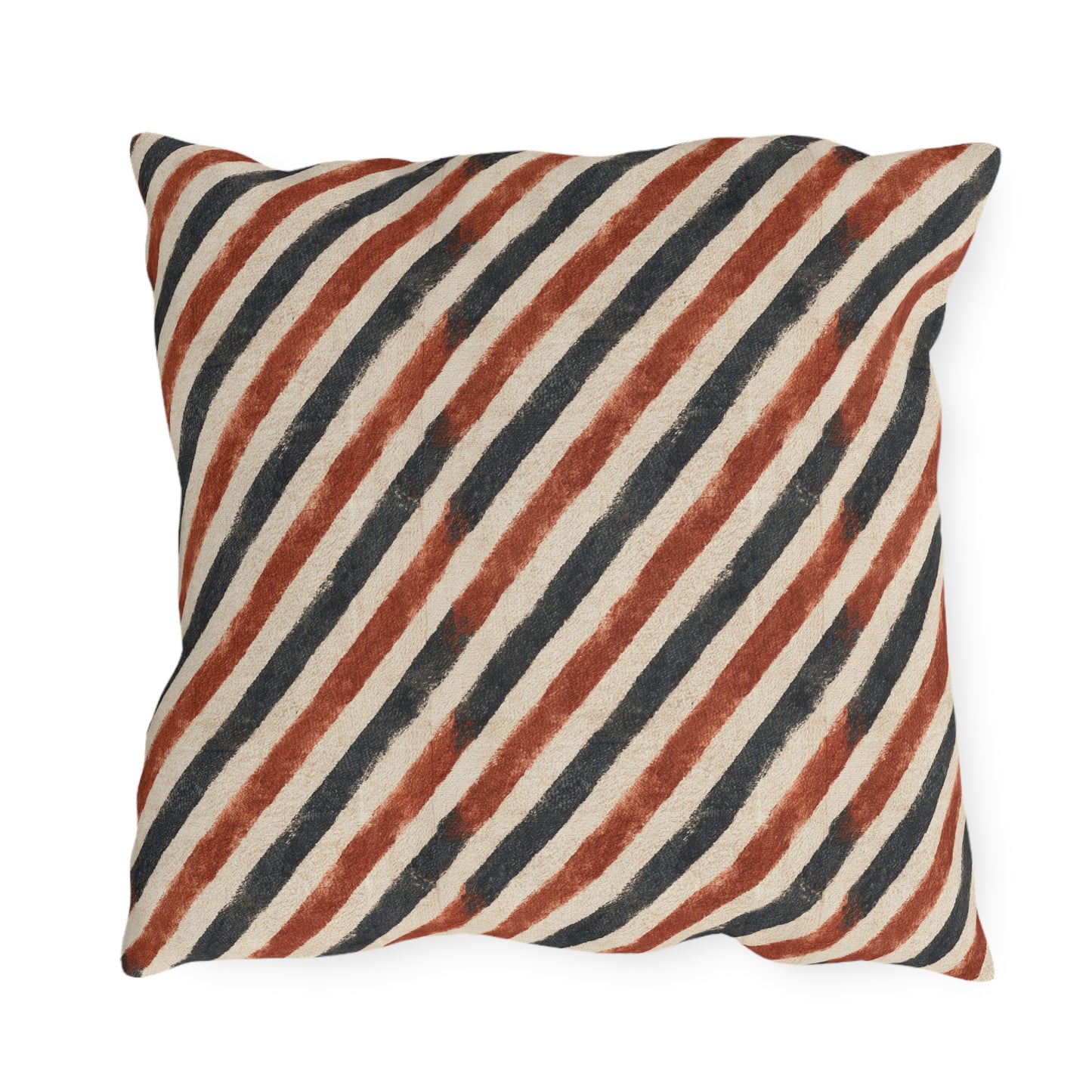 Diagonal rust and charcoal block-printed stripes on cream outdoor pillow