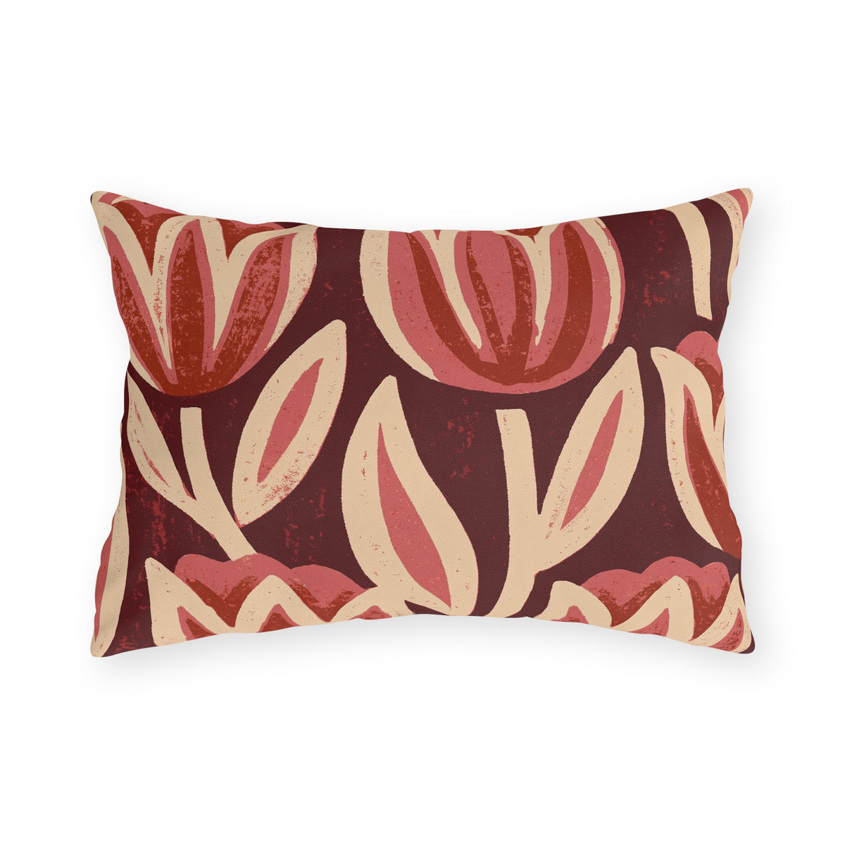Oversized block print tulips in rose and cream on a deep oxblood outdoor lumbar pillow