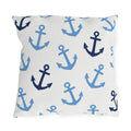 Nautical outdoor pillow with tossed light blue and navy anchors on bright white