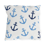 Nautical outdoor pillow with tossed light blue and navy anchors on bright white