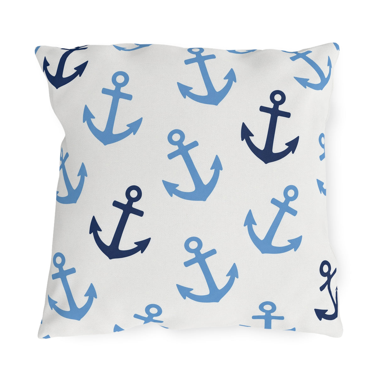 Nautical outdoor pillow with tossed light blue and navy anchors on bright white