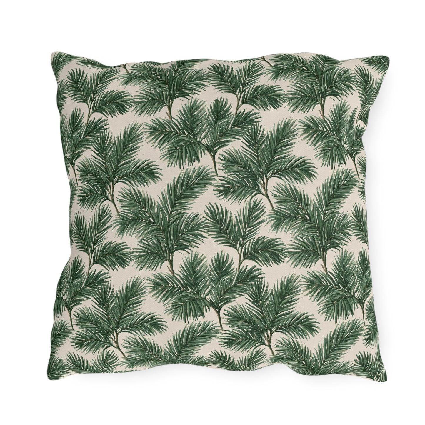 Deep green pine and fir branches on cream outdoor pillow