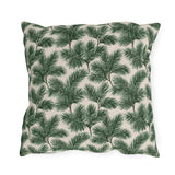 Deep green pine and fir branches on cream outdoor pillow