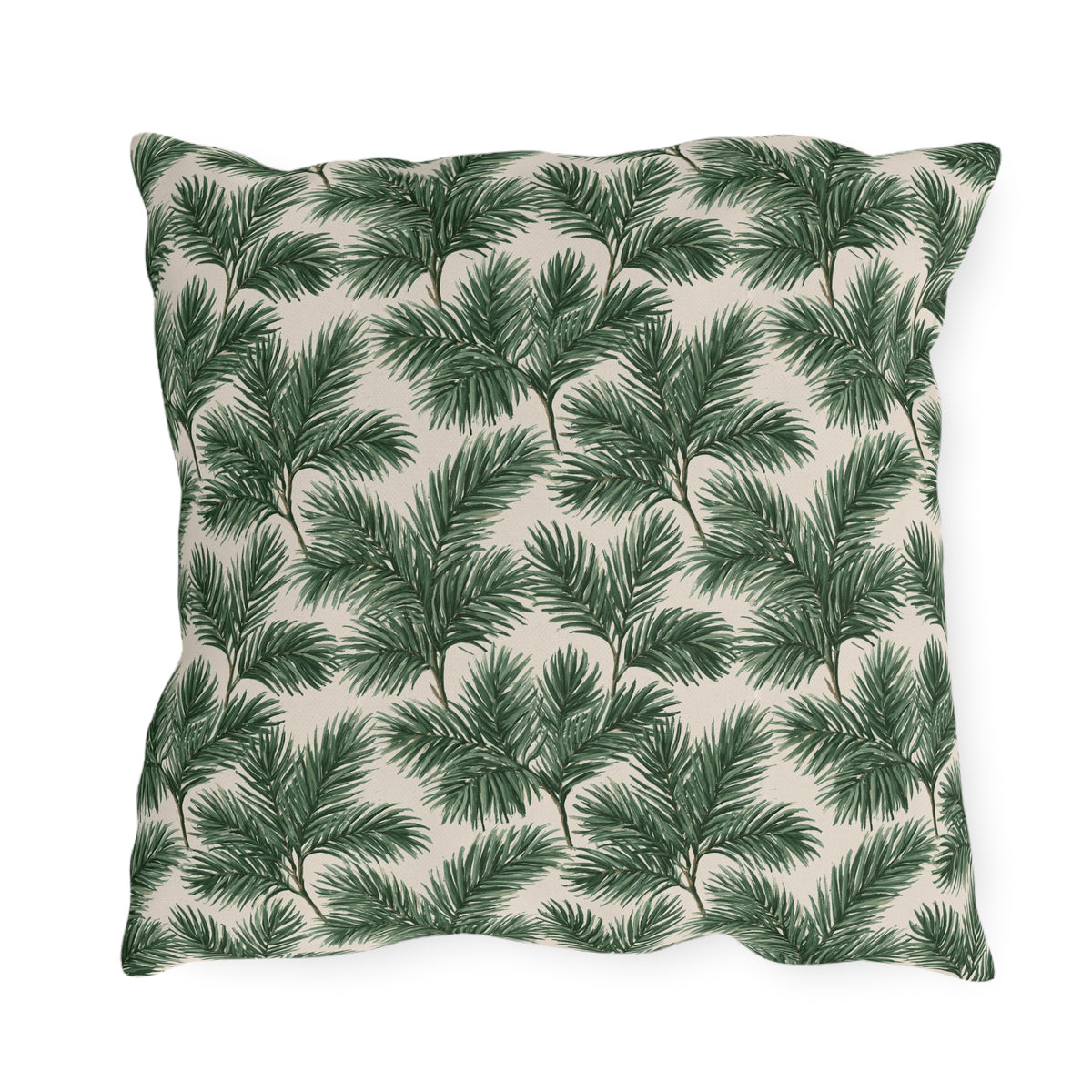 Deep green pine and fir branches on cream outdoor pillow