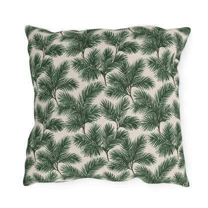 Deep green pine and fir branches on cream outdoor pillow