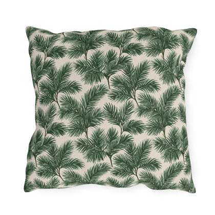 Deep green pine and fir branches on cream outdoor pillow