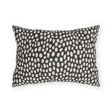 Hand-painted cream dots on charcoal outdoor lumbar pillow