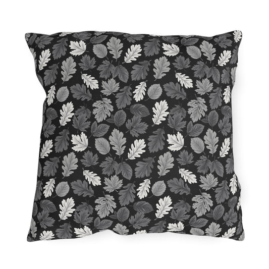 Charcoal, grey and white autumn leaves on black outdoor pillow
