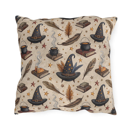 Witch hats, cauldrons, spell books and gold stars on parchment cream outdoor pillow