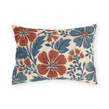 Block print floral outdoor lumbar pillow with brick red and denim blue flowers and leaves on cream