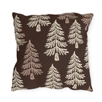 Cream fir trees on a dark chocolate outdoor pillow