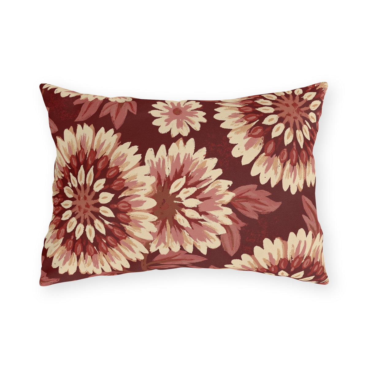 Cream and blush chrysanthemums on a deep oxblood outdoor lumbar pillow