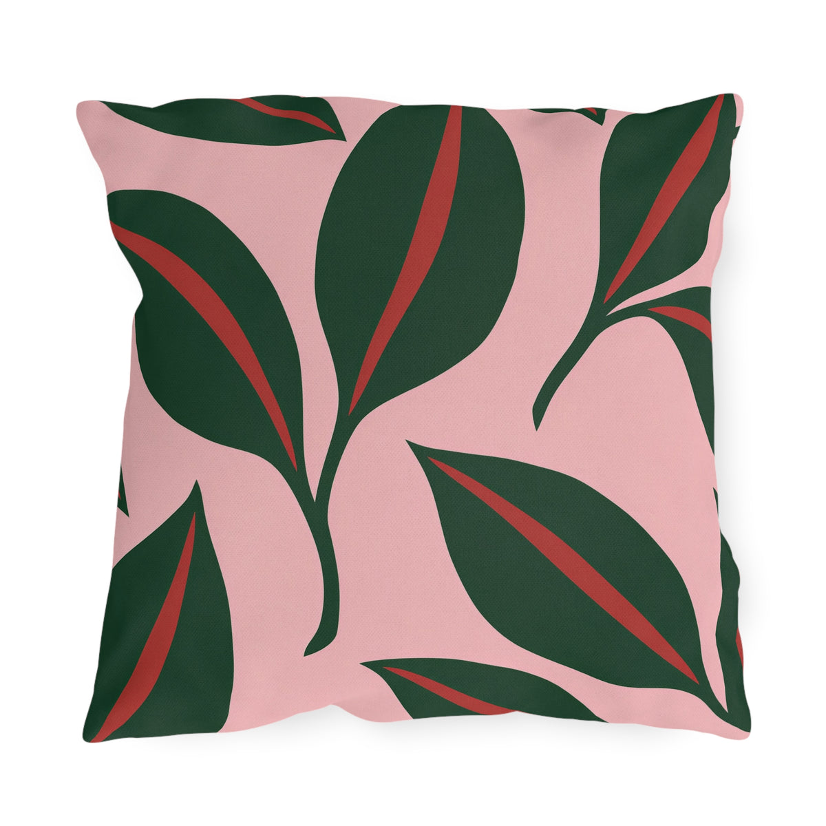 Modern outdoor pillow with oversized forest green leaves and red midribs on blush pink