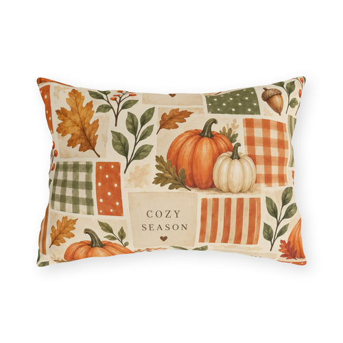 Watercolor pumpkin, acorn and autumn leaf patchwork outdoor lumbar pillow in orange and sage on cream