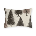 Large ink-sketched pine trees on a cream outdoor lumbar pillow