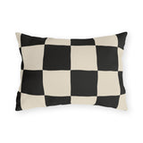 Black and cream checkerboard outdoor lumbar pillow with large hand-painted squares
