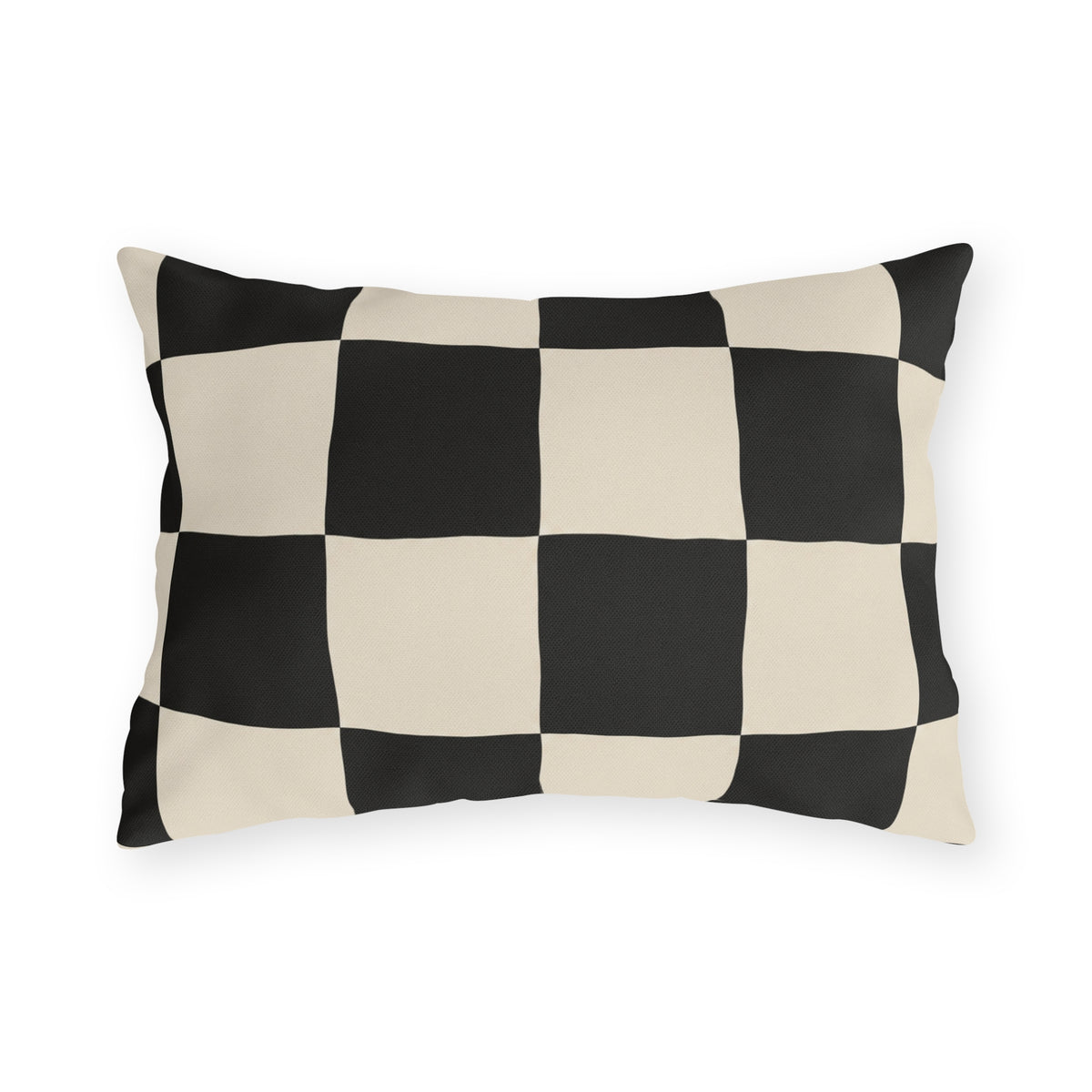 Black and cream checkerboard outdoor lumbar pillow with large hand-painted squares