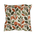 Rust leaves, olive seed pods and small blooms block printed on a cream outdoor pillow