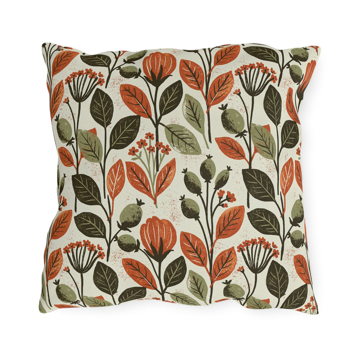 Rust leaves, olive seed pods and small blooms block printed on a cream outdoor pillow