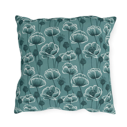 Teal and white poppies and seed heads on teal outdoor pillow