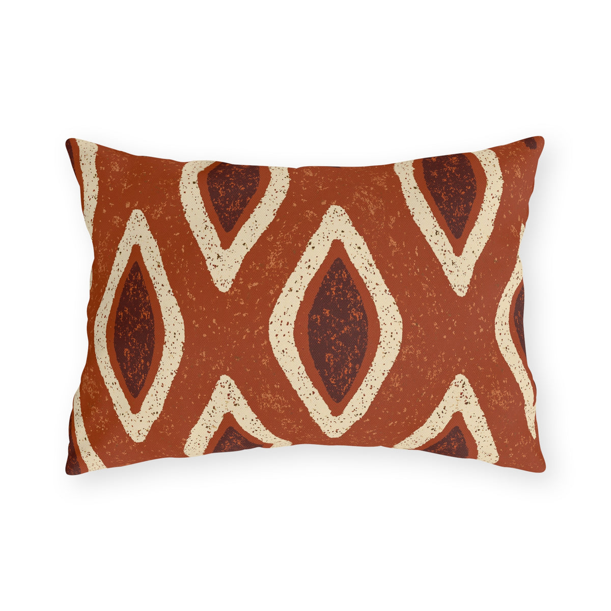 Cream and oxblood ikat teardrops on a burnt terracotta outdoor lumbar pillow