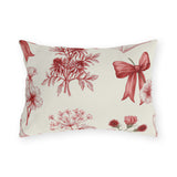 Red floral outdoor lumbar pillow with engraved toile wildflowers, ribbon bows and sealed love letters on cream