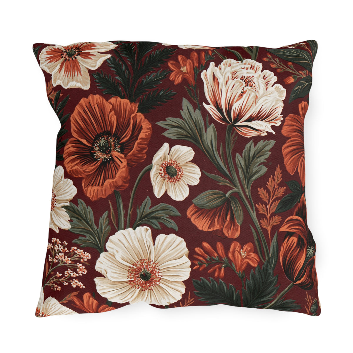Floral outdoor pillow with painted rust poppies, cream anemones and dark green leaves on burgundy