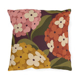 Mid-century hydrangea outdoor pillow with oversized pink, orange and mustard hydrangeas on plum