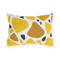 Yellow terrazzo outdoor lumbar pillow with large yellow and ochre stones and charcoal chips on white