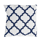 Navy and white quatrefoil outdoor pillow with a bold Moroccan trellis on crisp white