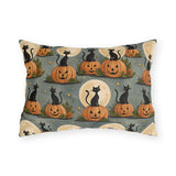 Black cats sitting on carved pumpkins under full moons on sage grey outdoor lumbar pillow