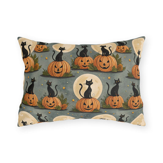 Black cats sitting on carved pumpkins under full moons on sage grey outdoor lumbar pillow