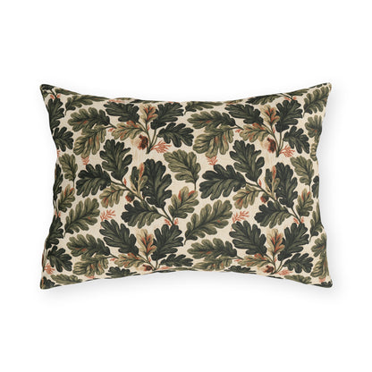 Deep green oak leaves and acorns on cream outdoor lumbar pillow