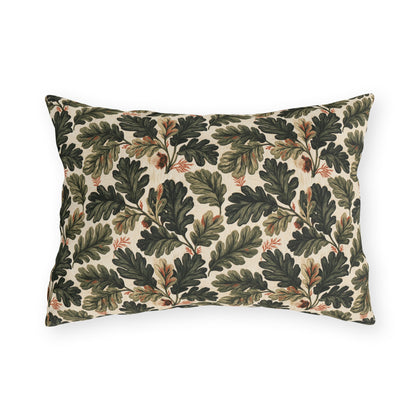 Deep green oak leaves and acorns on cream outdoor lumbar pillow