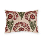 Block print floral outdoor lumbar pillow with wine red fan flowers, coral centers and olive leaves on blush