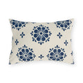 Navy block print outdoor lumbar pillow with flower medallions and small buds on warm white
