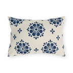 Navy block print outdoor lumbar pillow with flower medallions and small buds on warm white