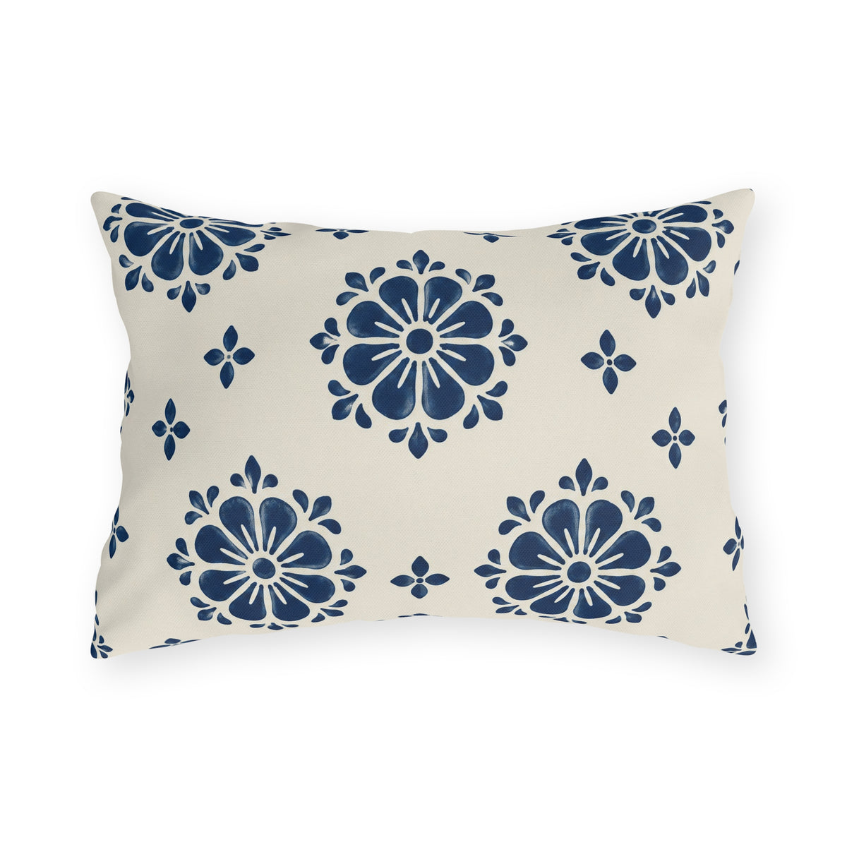 Navy block print outdoor lumbar pillow with flower medallions and small buds on warm white