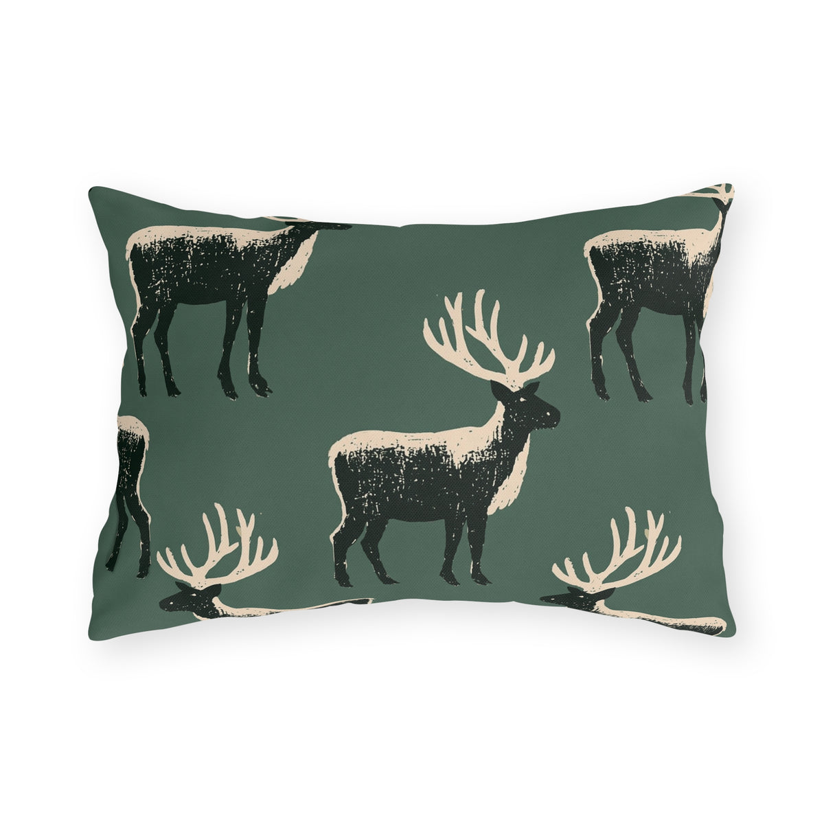 Black and cream block print stags on a deep forest green outdoor lumbar pillow