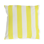 Bright yellow and cream cabana stripes on an outdoor pillow