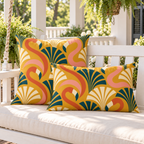 Mustard art deco flamingo outdoor pillow and outdoor lumbar pillow styled together as a set on a porch swing