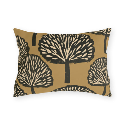Black and cream block print trees on a warm ochre outdoor lumbar pillow